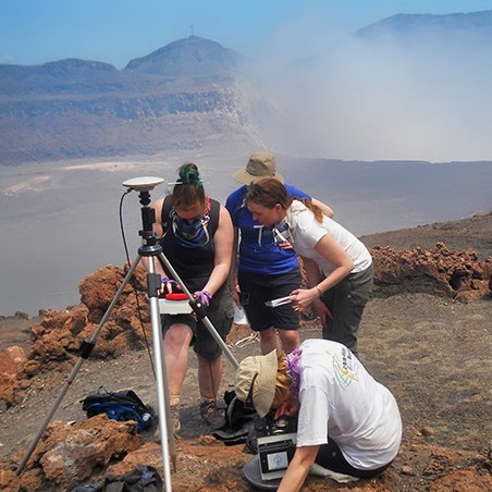 A group of students doing volcanic fieldwork.