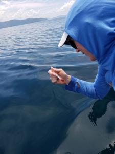 An Earthwatch volunteer measures water temperature (C) Tara Lepore