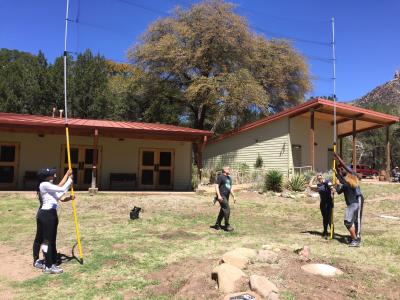 Earthwatch volunteers practice working with mist nets in Arizona